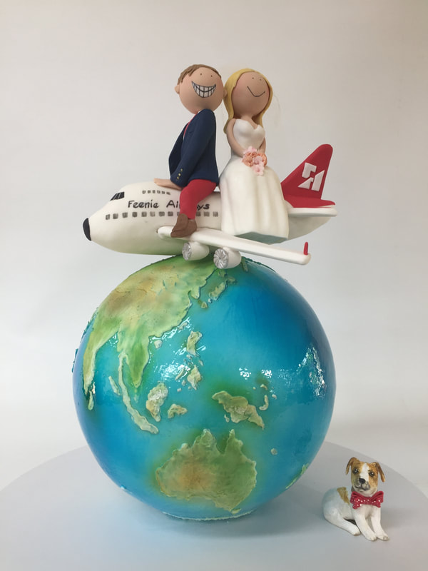3D globe wedding cake with figurines