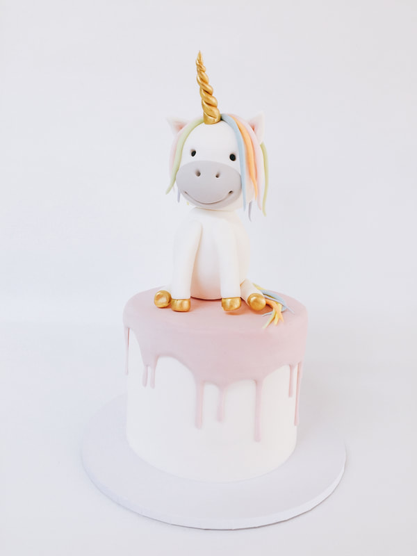 birthday cake with unicorn topper