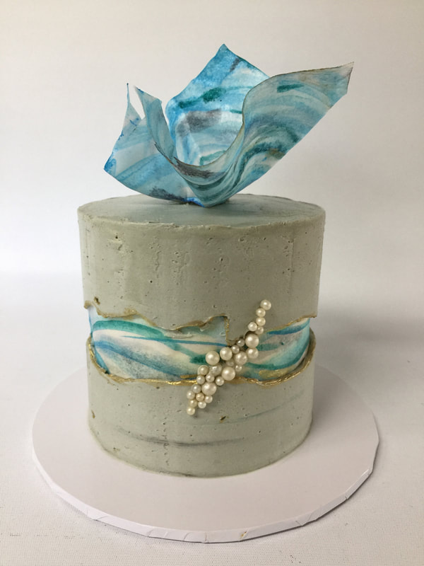 grey fault line cake with wafer-paper deco