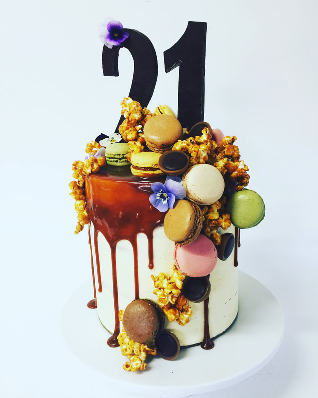 Drip cake with cascading confections