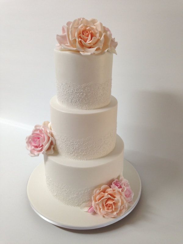 3 tier lace and sugar roses wedding cake