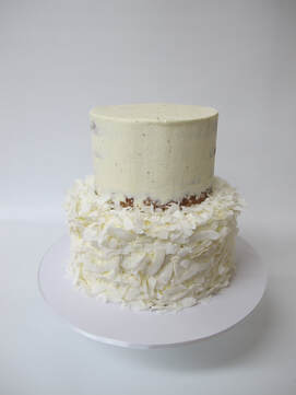 2 tier naked cake with coconut shavings