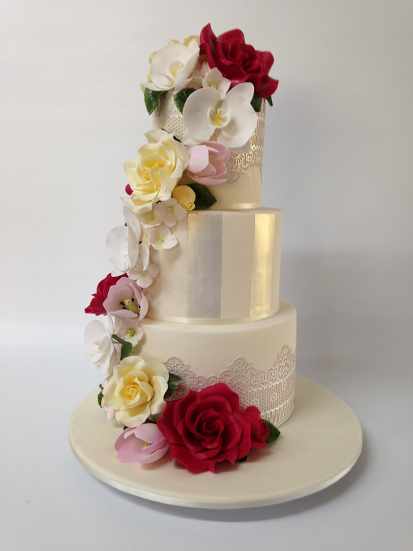 3 tier wedding cake with a summer sugar flower cascade 